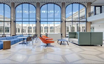 Terrazzo flooring in a modern public building lobby, showcasing durable and stylish architectural terrazzo surfaces for commercial projects