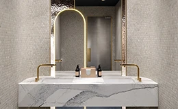 Luxury hotel bathroom vanity made of Calacatta printed quartz, showcasing seamless marble veining in a hospitality restroom design