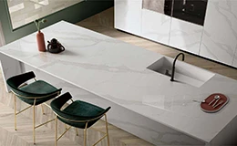 Contemporary kitchen island with seamless printed quartz surface, integrated sink, and minimalist design for high-end homes