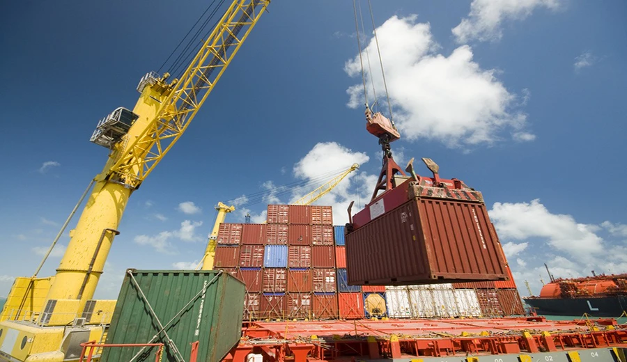 Port crane lifting shipping containers for multi-origin quartz supply, China Vietnam and Thailand production routes managed by AsiaQuartz
