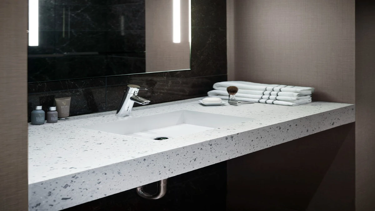Elegant hotel bathroom with premium quartz vanity tops, designed for low maintenance and long-term value in hospitality projects