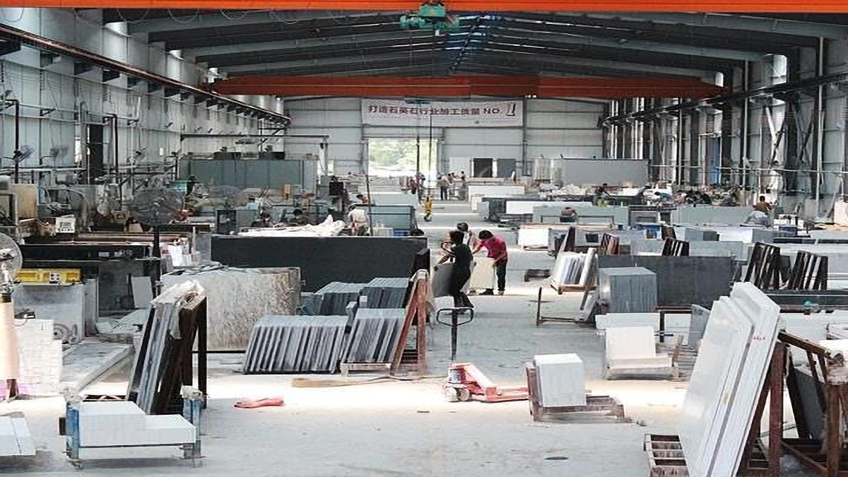 High-precision quartz slab fabrication workshop, with workers inspecting slabs for consistent quality