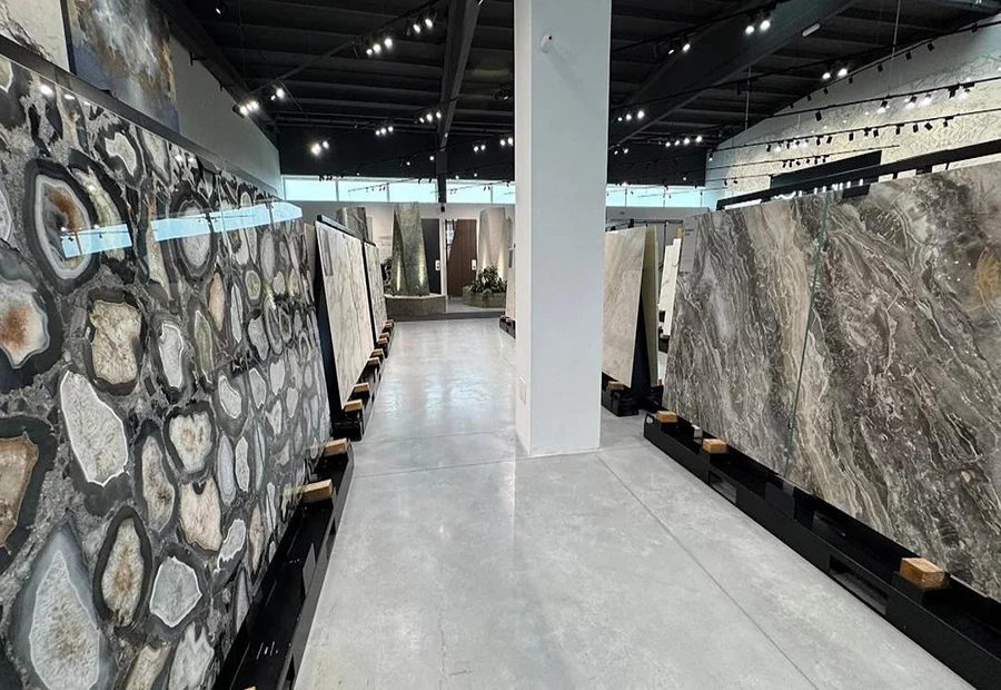 Quartz slab showroom with organized stone displays for wholesale buyers and fabricators