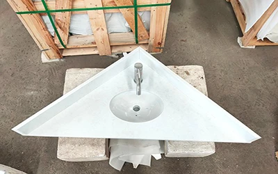 White quartz vanity tops with cutouts, ready for bathroom installation projects