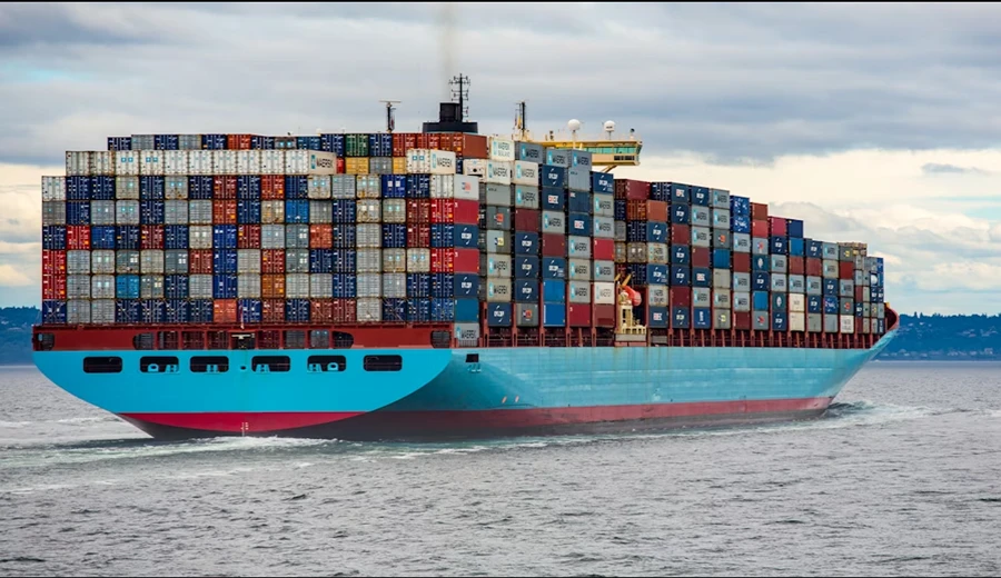 Container ship carrying loaded containers for global quartz slab export fulfillment
