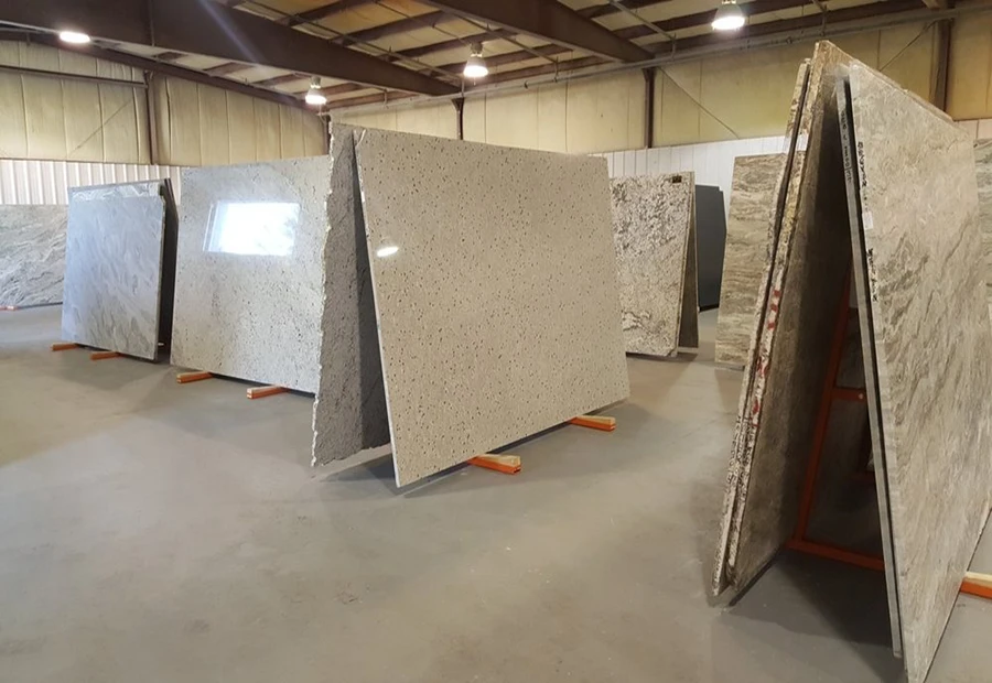 Modern stone factory warehouse with quartz slab quality control and production management
