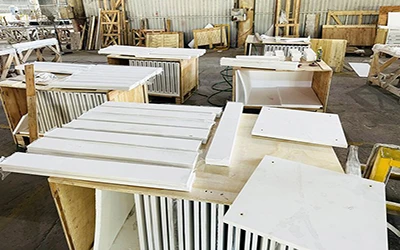 Close-up of polished white quartz countertop edge, showing smooth finish and precise bevel fabrication