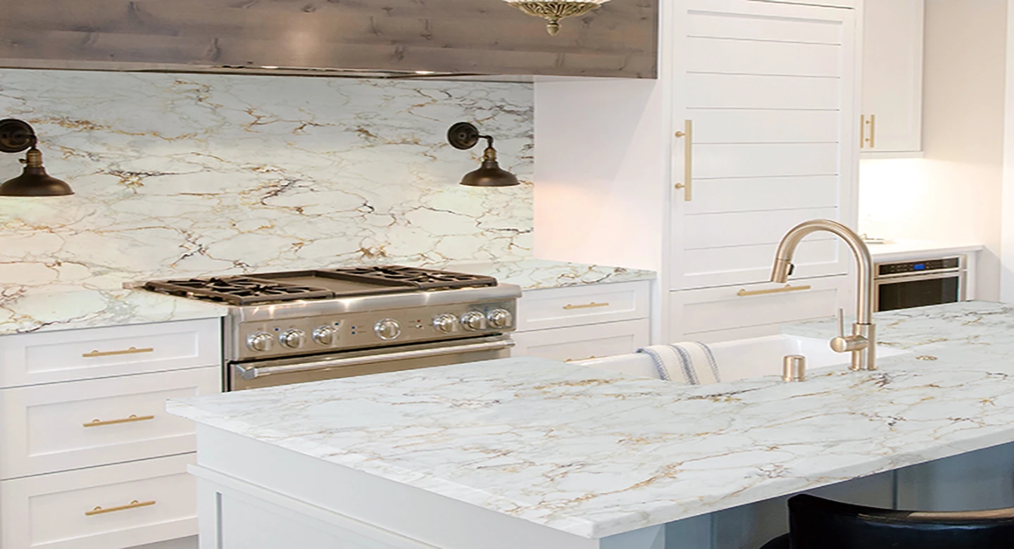 Modern luxury kitchen with gold-vein printed quartz countertops featuring realistic marble look, ideal for residential projects