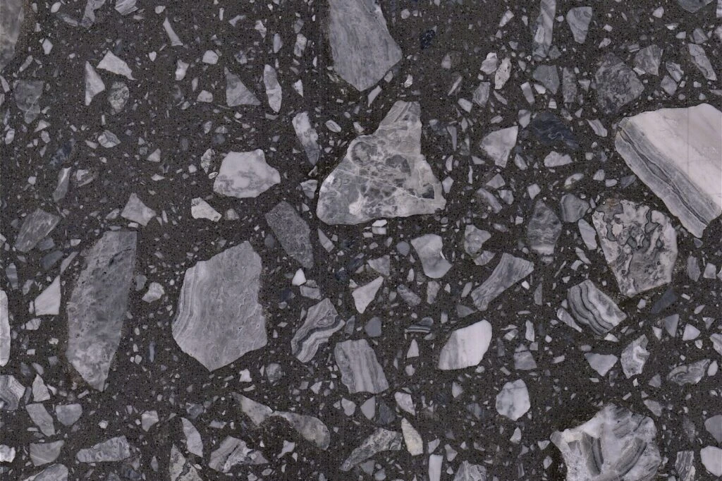 Grigio Deep Ocean terrazzo slab by AsiaQuartz - dense charcoal black base with irregular grey rock aggregates for kitchen countertops and wall cladding