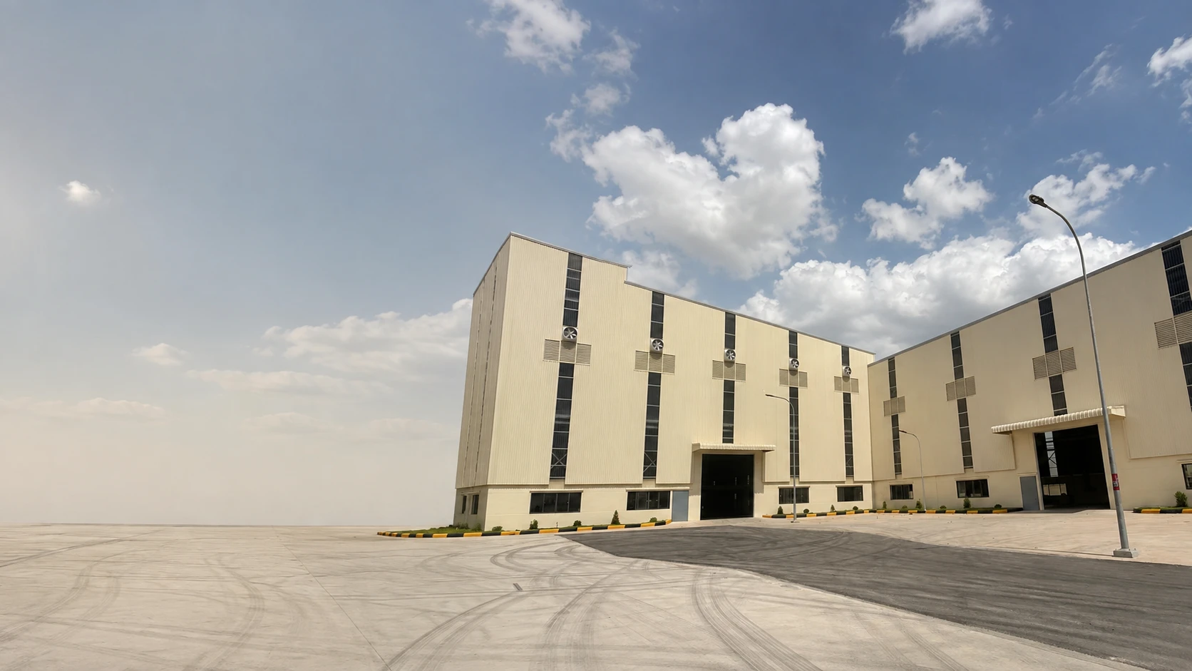 Quartz manufacturing facility exterior supporting engineered stone production and B2B supply programs